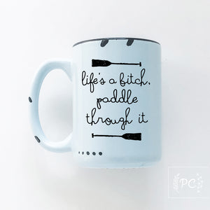 life's a bitch paddle through it | ceramic mug
