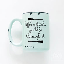 life's a bitch paddle through it | ceramic mug