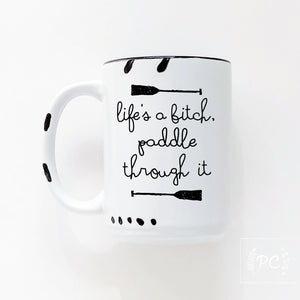 life's a bitch paddle through it | ceramic mug